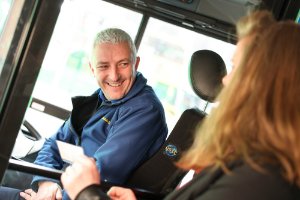 bus driver chatting to customer 