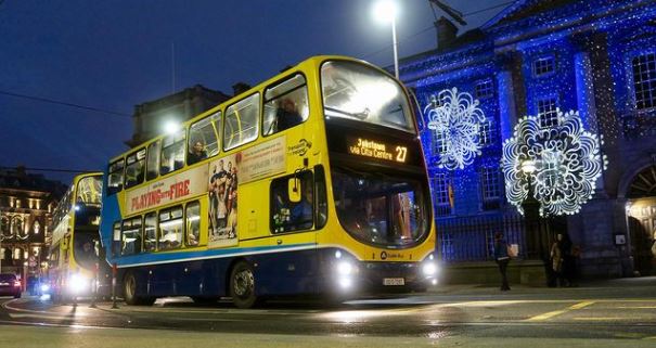 Image of a Dublin Bus from the side, yellow and blue bus colour.