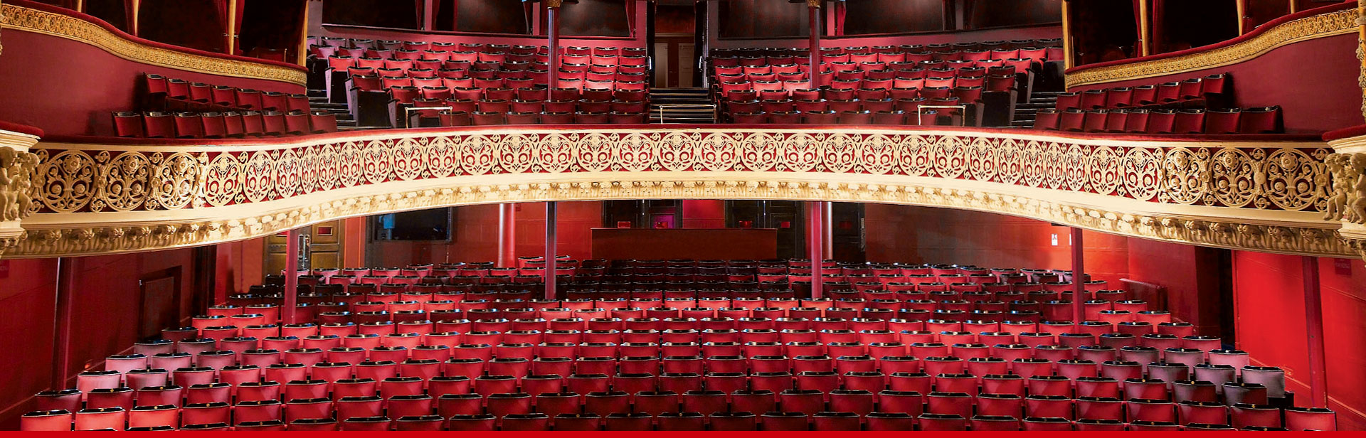 View from the stage inside the Gaiety Theatre, showing the seats and balconies.
