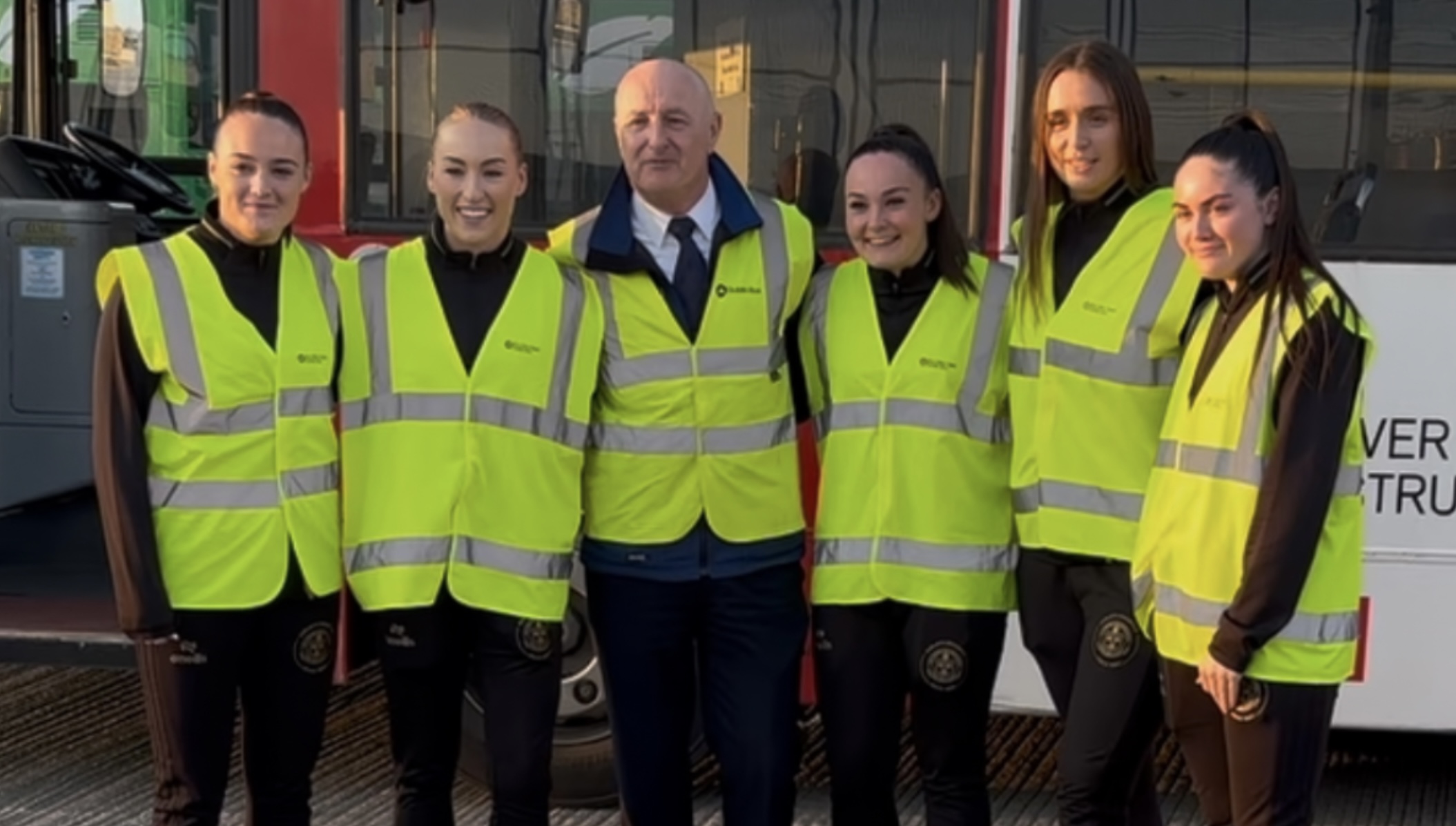 Image of five Female Bohs players with a male Dublin Bus driving instructor.